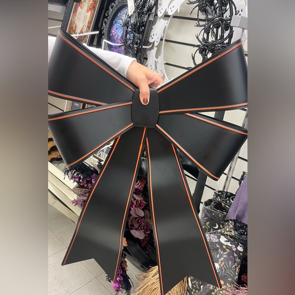 Black metal door bow